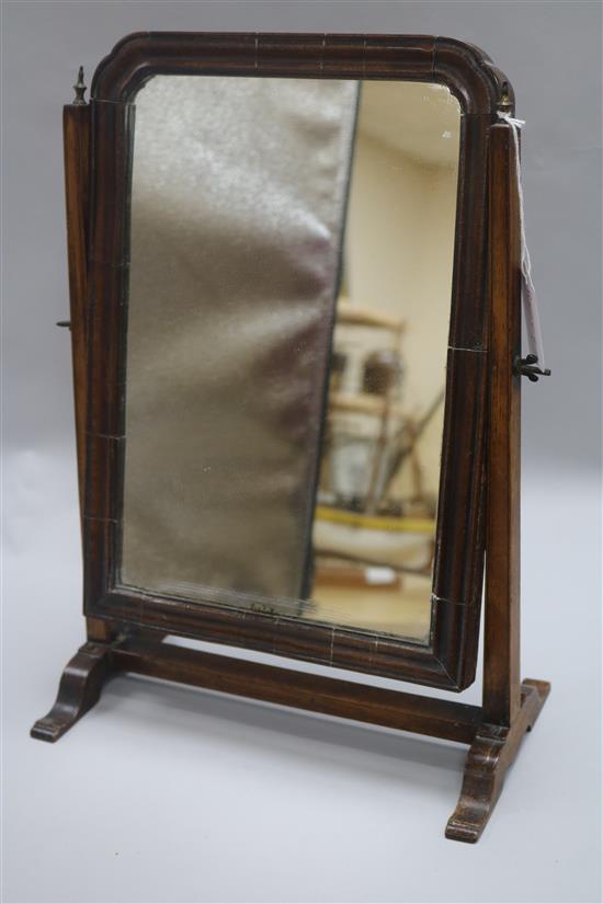 A toilet mirror H.41cm, W.27cm